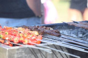 grilling adana kebap which is made from minced lamb meat