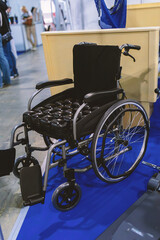 Reinforced wheelchair with brake keys for assistant.