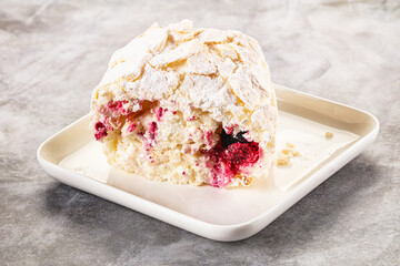 Delicous meringue roll with cherry