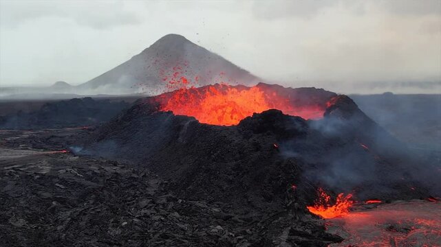 Super slow-motion footage of a volcano erupting in Iceland, capturing lava explosions from the crater and molten lava flowing across the dark volcanic terrain.