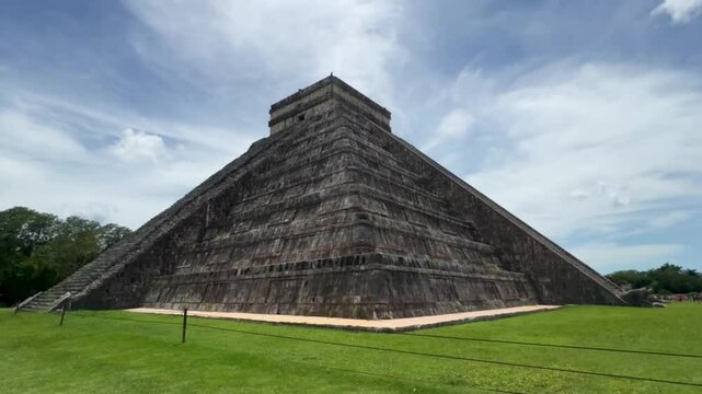 Handheld ultra wide angle tilting up shot from the corner of the pyramid of Kukulkan at Chichen Itza in Yucatan, Mexico. 4K