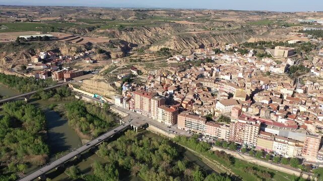 Scenic spring aerial view of El casco or Fraga la Vieja, old historic district of Spanish town of Fraga located on hilly Cinca river valley on sunny day. High quality 4k footage