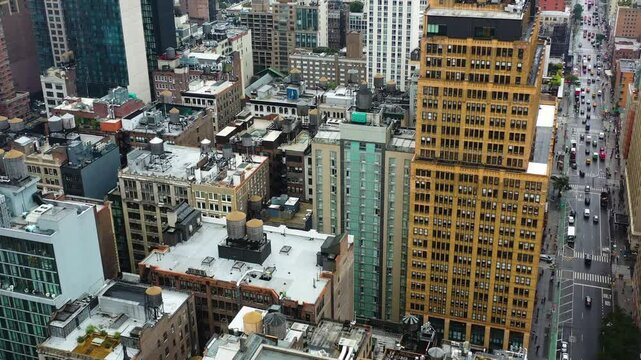 Aerial view over diverce building rooftops in cloudy Midtown, New York, USA