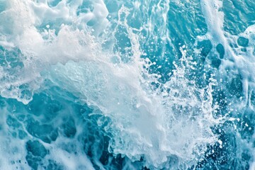 Fototapeta premium The image captures the dynamic movement of sea foam and splashes in restless ocean waves under bright daylight, symbolizing energy and perpetual motion.