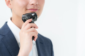 Fototapeta premium 髭を剃るビジネスマン
