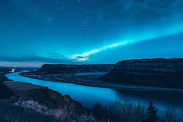 Fototapeta premium A serene river under a starry night sky enhanced by vibrant northern lights, with dramatic cliffs framing the landscape in a spectacular natural display.