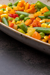 Mexican Mix of Vegetables. Tomatoes, Green Beans, Peas, Corn. Dietary Food.Bright vegetable mix .Vegetarian food.Assorted.