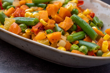 Mexican Mix of Vegetables. Tomatoes, Green Beans, Peas, Corn. Dietary Food.Bright vegetable mix .Vegetarian food.Assorted.