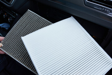 Air filter in the car. Air conditioning in the vehicle. Old and new filter.