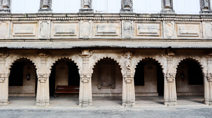 View of the carved arches of the courtyard of Naulakha Palace, Gondal, Rajkot, Gujarat, India.