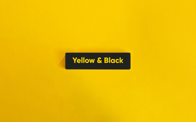 Yellow and Black. Text on Block Letter Tile on Yellow Background. Minimal Aesthetic.