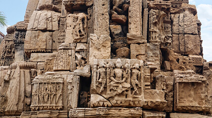 Ruined sculptures of Hindu deities on the ancient Mahadev Temple, Madhavpur, Porbandar, Gujarat, India.
