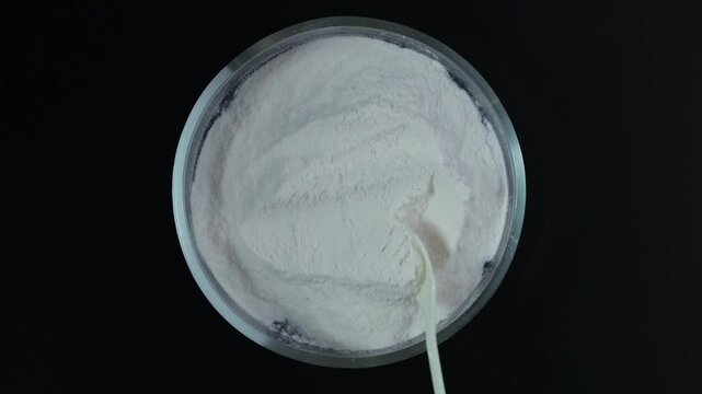 Sodium carboxymethyl cellulose (NaCMC) in glass Petri dish. Binding agent, Thickener. Increases moisture retention and Extends shelf life products. Texture improver. Food additive E466.