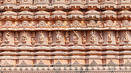 Carved sculptures of Hindu deities on Shree Khondaldham Temple, Kagvad, Rajkot, Gujarat, India.