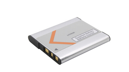 Old lithium battery from a camera with gold contacts on an isolated background.