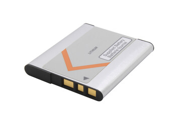 Old lithium battery from a camera with gold contacts on an isolated background.