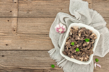 Raw black morel mushrooms with fresh parsley. Vegan ingredient for cooking healthy food