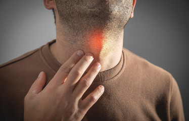 Fototapeta premium Caucasian sick man having sore throat.