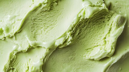 Obraz premium A close-up of smooth, creamy green ice cream with a textured surface.