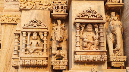 Carved sculpture of Hindu deities on Shri Trinetreshwar Mahadev Temple, Taranetar, Surendranagar, Gujarat, India.