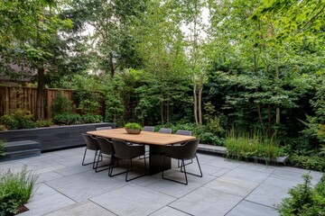 A sleek outdoor dining area set amidst a lush garden with a large wooden table and stylish chairs, creating an oasis for communal gatherings and outdoor dining.