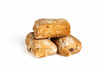 Several almond polvorones in close-up and on a white background, a typical Christmas sweet.
