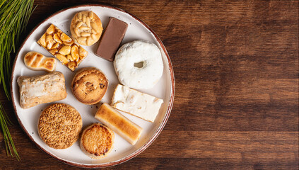 Plate with various Christmas sweets, mantecado, donut, nougat, marzipan among other sweets, top...