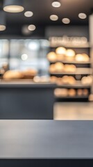 A blurred interior of a bakery showcasing shelves filled with bread.