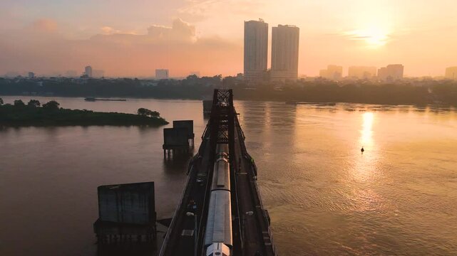 Aerial view of Long Bien bridge over Hong river (or Red river) that connects two districts, Hoan Kiem and Long Bien in Hanoi city, Vietnam.