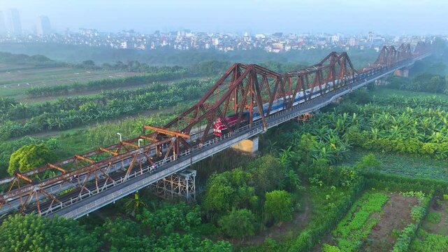 Aerial view of Long Bien bridge over Hong river (or Red river) that connects two districts, Hoan Kiem and Long Bien in Hanoi city, Vietnam.