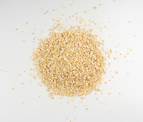 Dry raw oat flakes isolated, rolled flat grains, instant porridge, thin cereals, flattened grains group