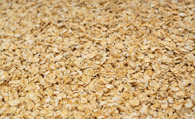 Dry raw oat flakes texture background, rolled flat grains pattern, instant porridge mockup, thin cereals