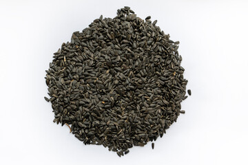 Pile of sunflower seeds isolated on white background