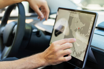 Man using gps navigation system while driving car