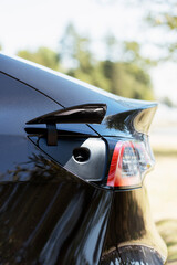 Fototapeta premium Charging port open and ready on modern electric car