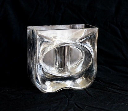 Mid-century modern style glass vase on black background