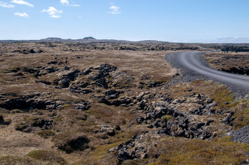 Snaefellsnes Peninsula Iceland, view across basalt lava field with asphalt road
