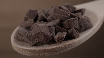 Dark Chocolate Chunks on a Wooden Spoon