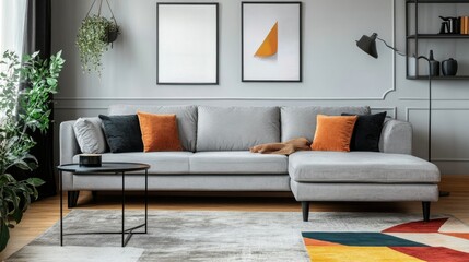 Stylish gray sofa with plush cushions in a bright living room, complemented by a modern rug and accent decor