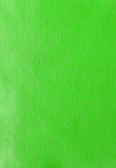 Texture of genuine leather, artificial leatherette green background