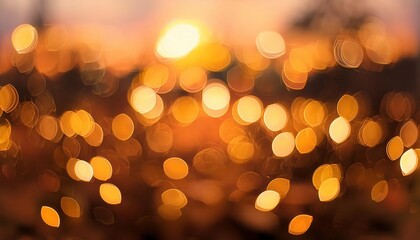 Fototapeta premium Radiant Golden Bokeh Lights Blurred in Soft Focus Against a Serene Sunset Sky. Perfect for Creating Dreamy, Festive, or Elegant Atmospheres in Photography, Event Design, and Creative Visual Projects
