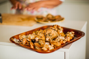 Tray of fresh wild mushrooms in a home kitchen