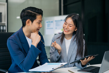 teammates negotiate in board room, sit at table, exchanging opinions.
