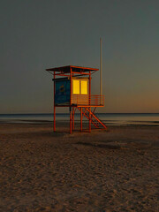 lifeguard tower at sunset