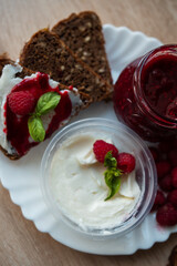 Summer breakfast with berries, butter, bread