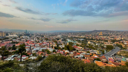 A panoramic view of Tbilisi, Georgia, showcases historic architecture and the Kura River, perfect for travel and urban exploration themes © fotoworld