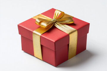 Elegant red gift box with a golden ribbon and bow, isolated on a white background. Close-up image highlighting luxury gift wrapping for marketing, product displays, and festive design projects