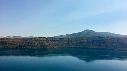 Scenic view of Lago Albano with lush hills in the background, symbolizing tranquility and nature tourism in Italy