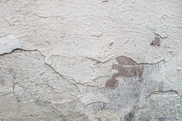 abstract background of an old shabby painted white wall close up