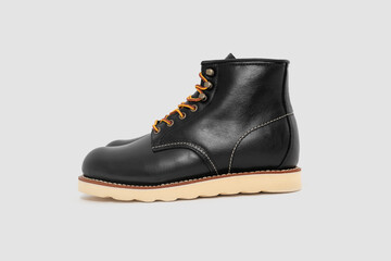 Black leather boots on white background. Fashion 